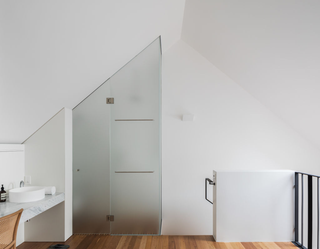 The only discrete room is the small toilet and shower stall behind a frosted glass wall. Photo: Katherine Lu Photo: Katherine Lu