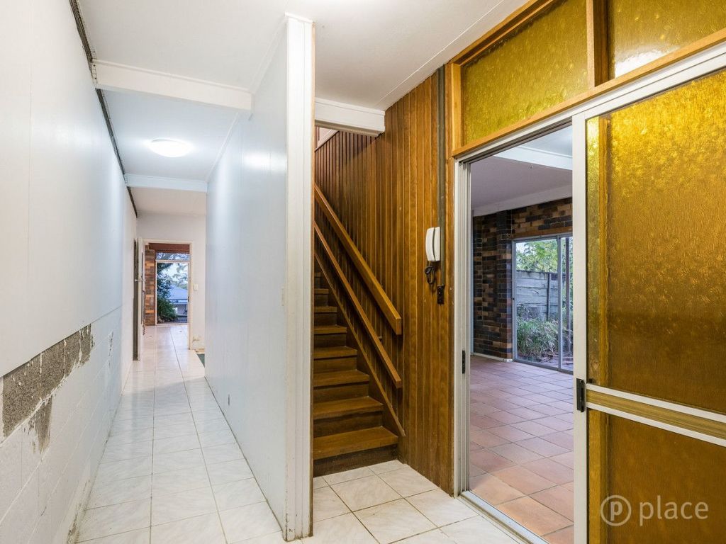 That '70s orange glass: 13 Garvary Street, Holland Park West, is a retro gem currently up for sale. Photo: Place Estate Agents Wolloongabba Photo: undefined