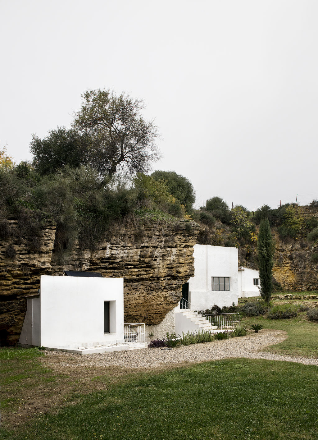 Embedded right into the foothills of Sierra Morena in Spain, Casa Tierra is carved into the sloping strata of limestone. Photo: David Vico Photo: David Vico