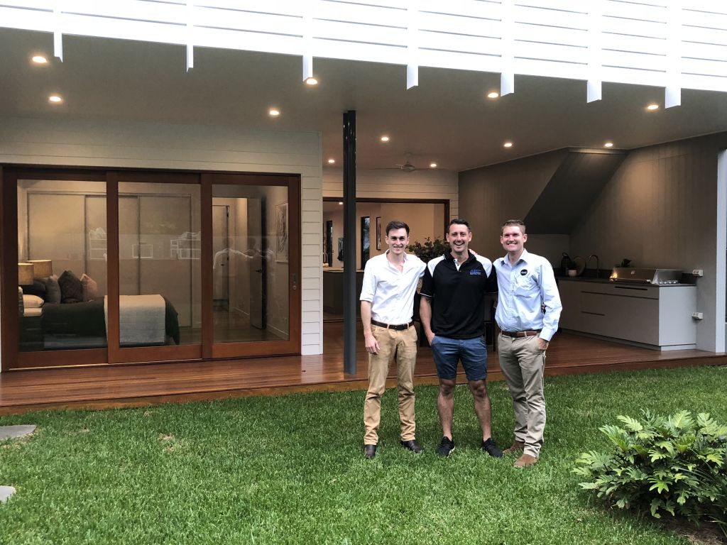 The three men behind Brisbane's smartest house: James McElhenny (white shirt) Paul McElhenny and Harley Weston at 5 Ross Street, Paddington. Photo: Supplied.