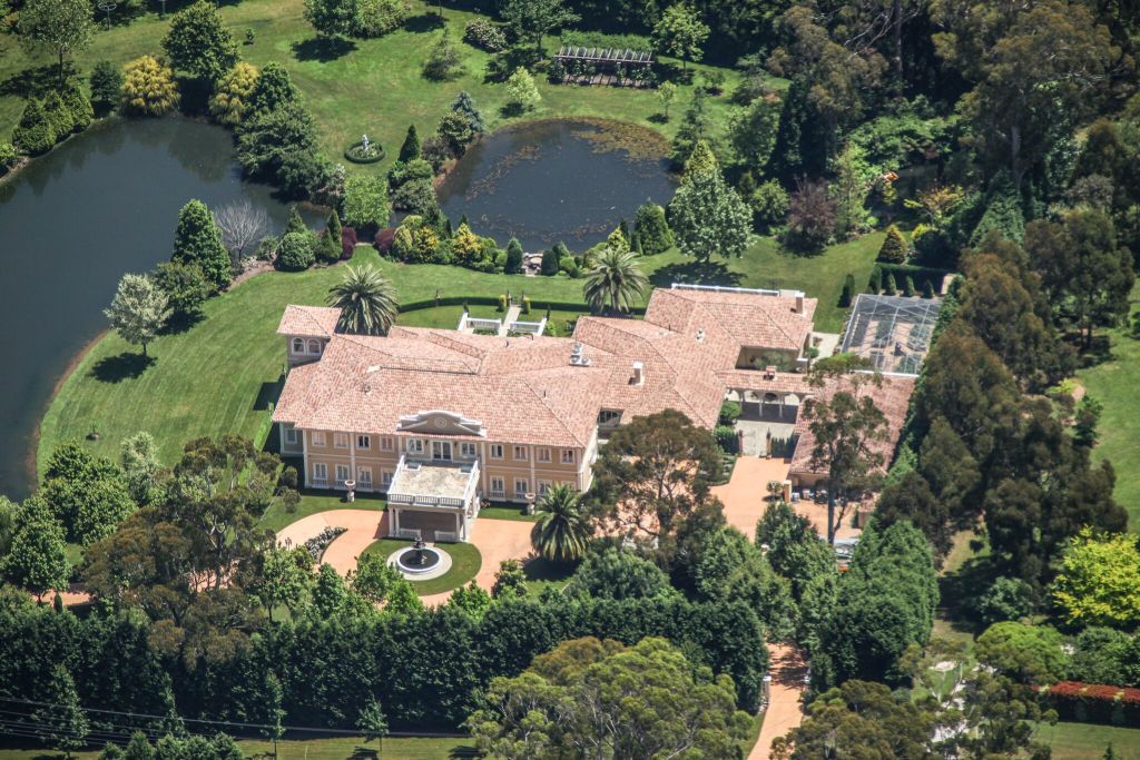 The two-hectare estate has an ornamental lake and landscaped grounds with fountains, waterfalls and grotto. Photo: Supplied