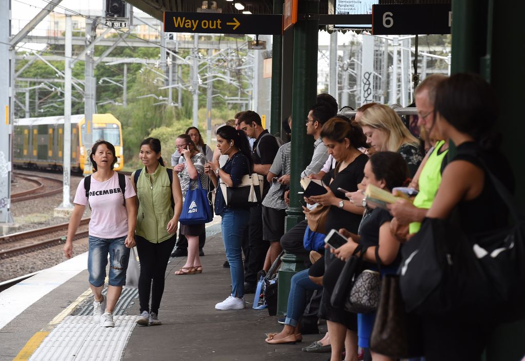 Commuters wait for the train to arrive at Strathfield, which has a median house price of $2.65 million. Photo: Kate Geraghty Photo: Kate Geraghty