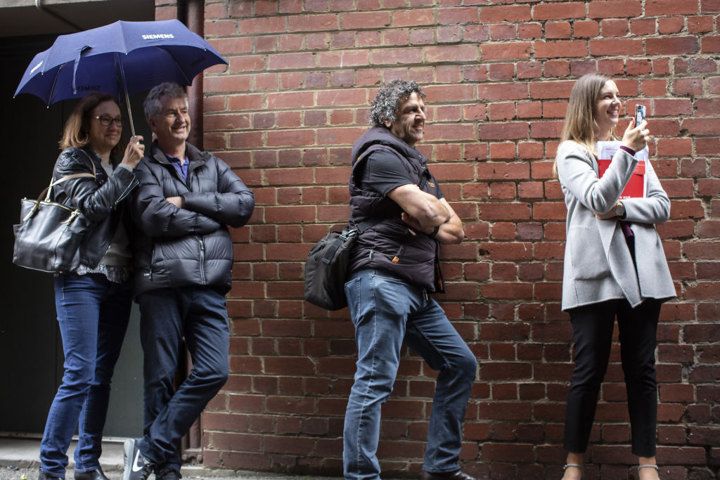 Buyer Costa Kouros (middle) waited until the eleventh hour to bid. Photo: Stephen McKenzie