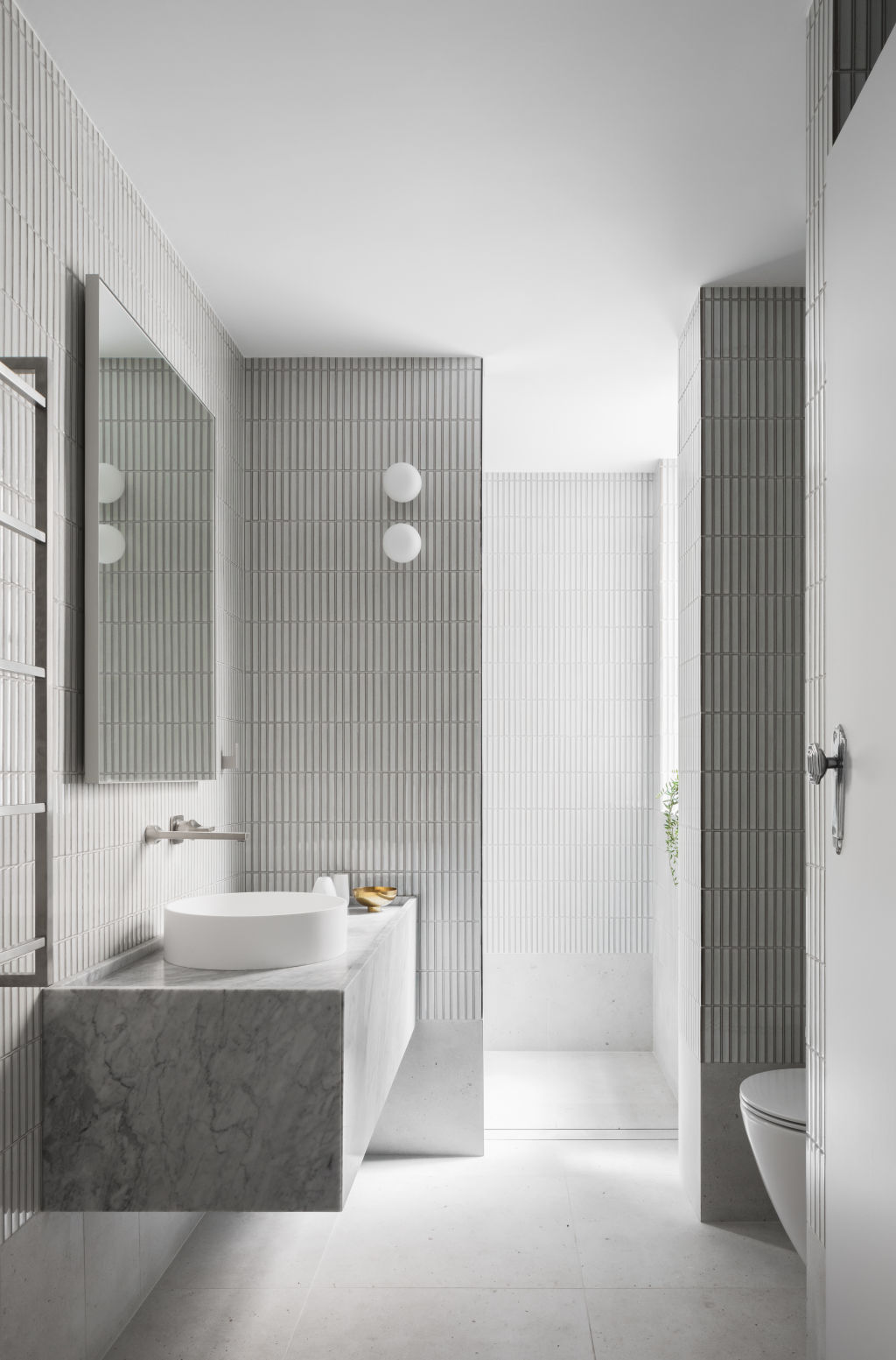 The bathroom is a vision in soft grey tones. Photo: Katherine Lu Photo: Katherine Lu