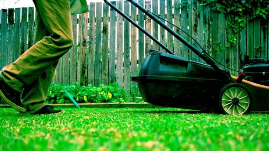 Outsourcing jobs like mowing the lawn became a thing in the 1990s. Photo: Stocksy
