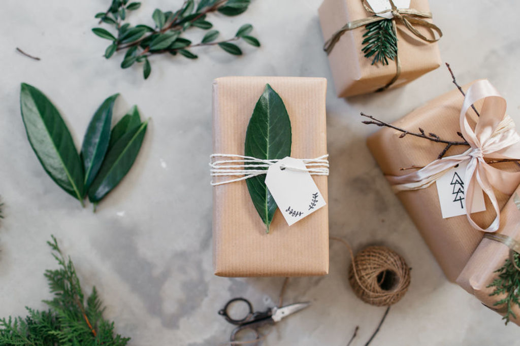 Each present would be decorated within a carefully curated palette of alternating plain, coloured papers with accents like brown paper and twine. Photo: Stocksy