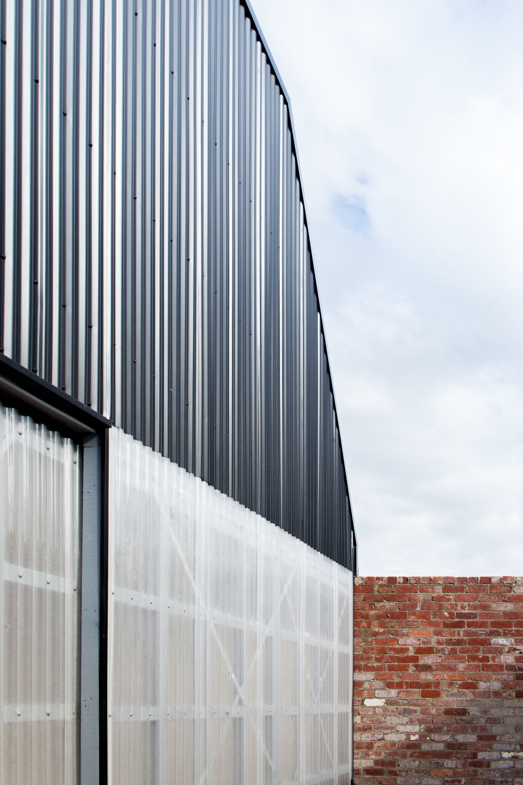 The laneway's brick facade is made from recycled materials.