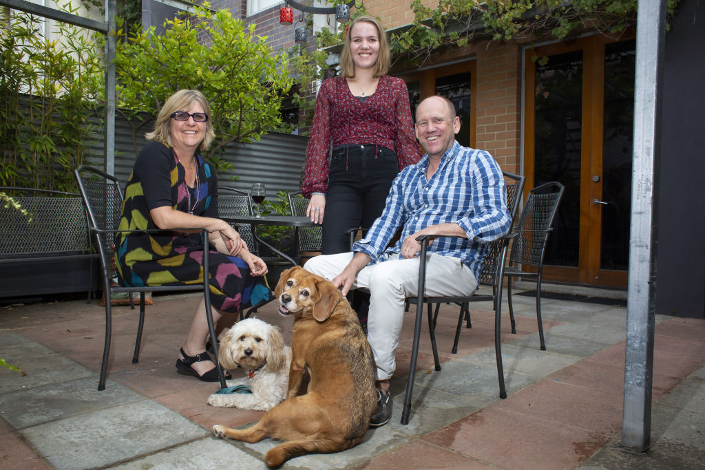 Stephen Moulton, with his wife Cathie, daughter Isabelle and dogs Murphy and Louis at home in Carlton. Photo: Stephen McKenzie