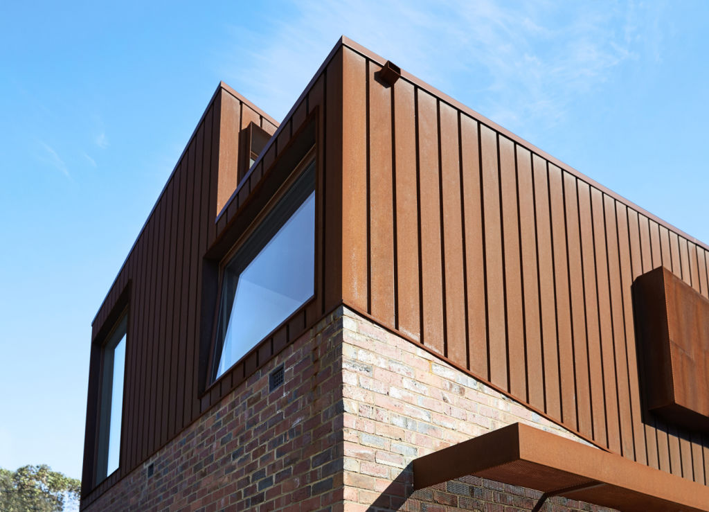 On the outside, clinker brick now meets the introduced cladding of Corten, or weathering steel. Photo: Willem-dirk du Toit