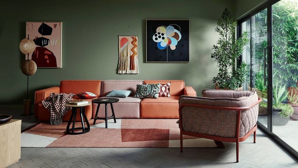 Coral accents are teamed with Dulux Herbalist on the walls of this colourful room. Photo: Dulux