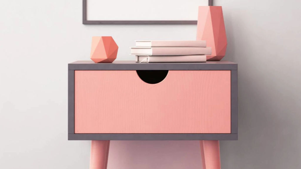 This coral bedside cabinet is edged in grey. Photo: 123RF