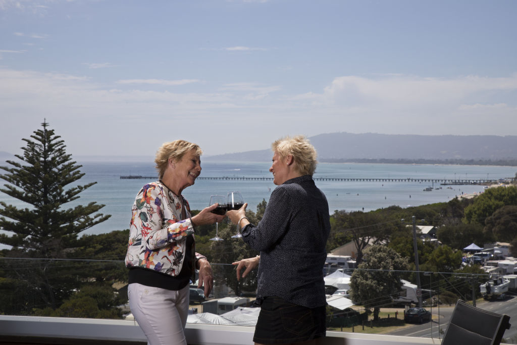 Katie Parkes and Lisa Shergold overlooking the beach from their home in Rye. Photo: Leigh Henningham Photo: Leigh Henningham