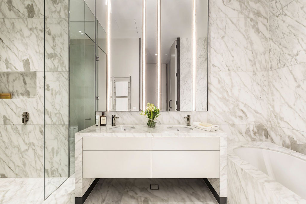 Marble decorates the ensuite bathroom from floor to ceiling. Photo: Supplied
