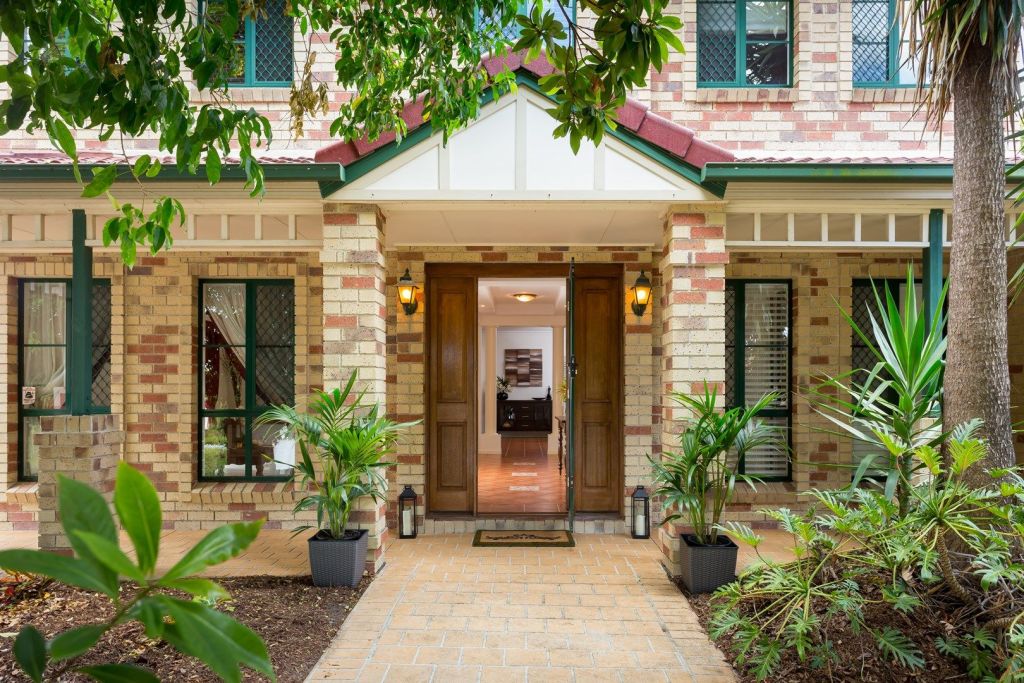 Replica Queenslander houses like this property at 26 Hereford Street, Carindale, became popular for their character without the maintenance of timber and tin. Photo: Hutton and Hutton