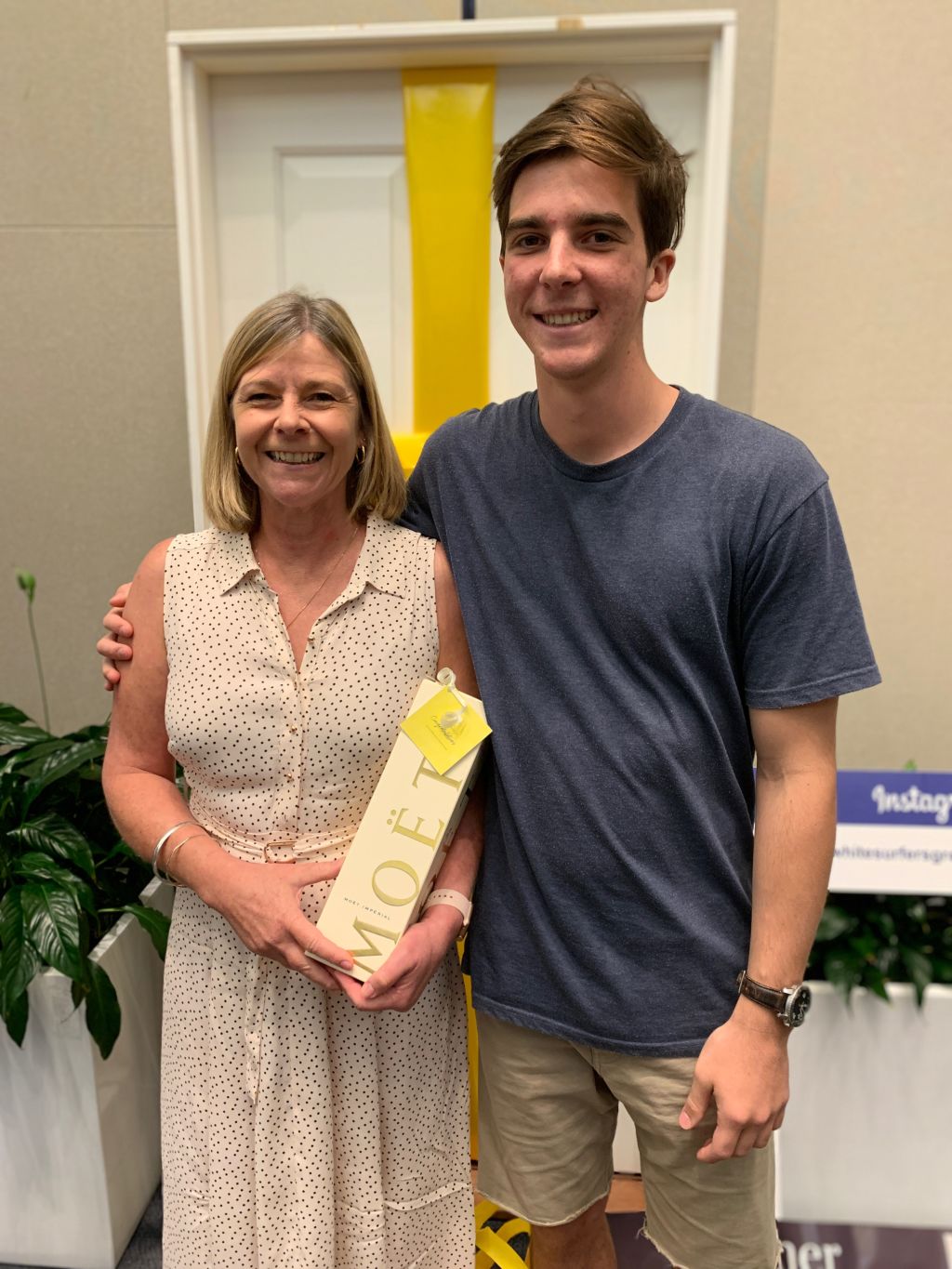 Gold Coast local Lyndal Solomon and her son Fraser will now call 1/56A Back Street, Biggera Waters home, after making the winning bid of $1,010,000 at the Ray White auction Event on Monday, Jan 28. Photo: Ellen Lutton