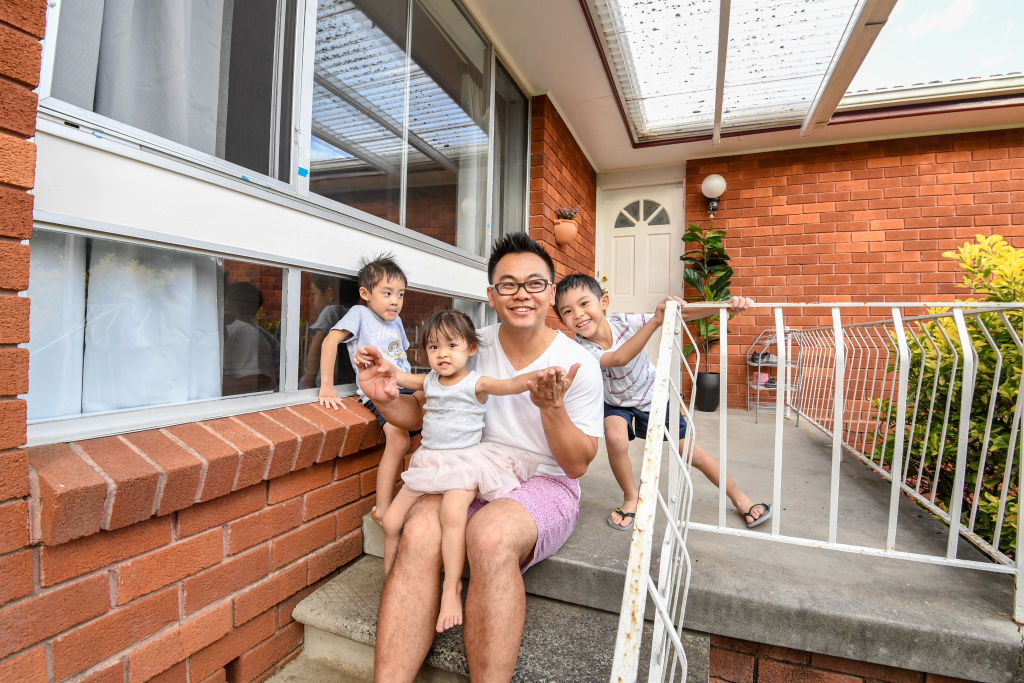 Falling prices have made it more affordable for buyers like Alex Chau, pictured with children Lyla-Rose , 2 , Cooper, 4 and Hudson 6, to get into the market.  Photo: Peter Rae. Photo: Peter Rae.