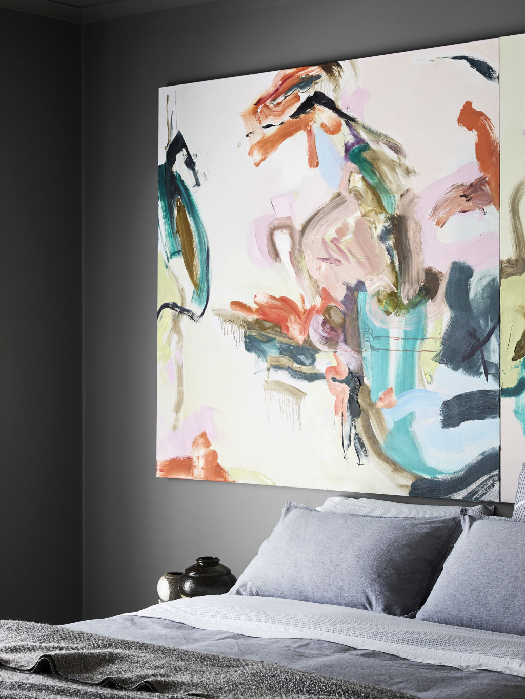 The master bedroom featuring a gorgeous feature artwork by Steve. Photography / Caitlin Mills Styling / Annie Portelli