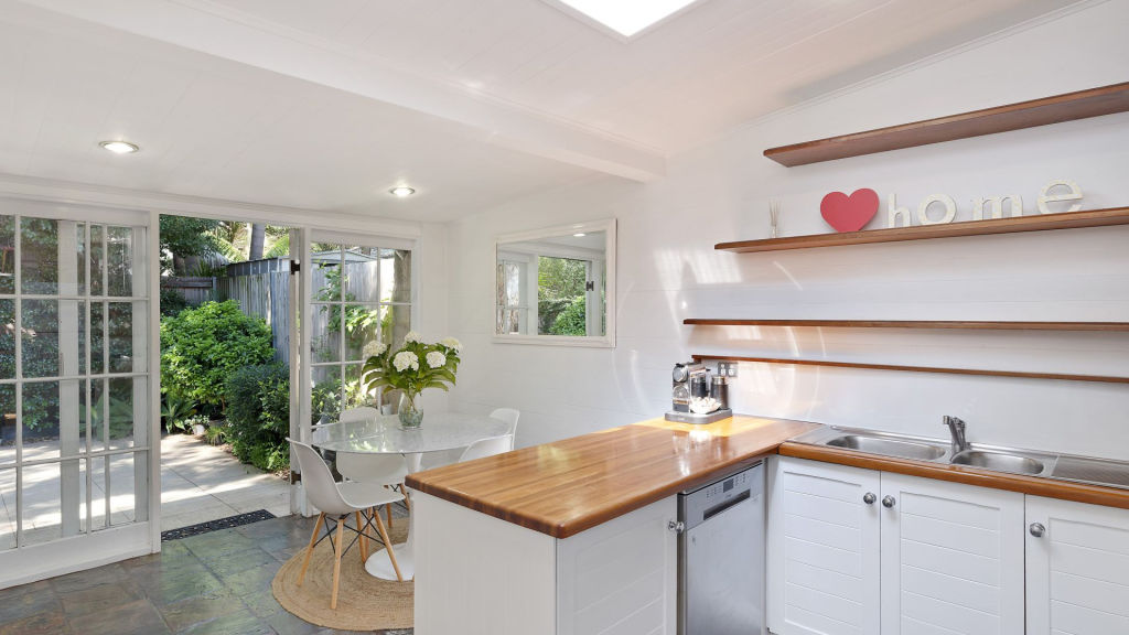 The kitchen looks out to the property's leafy courtyard. Photo: Supplied
