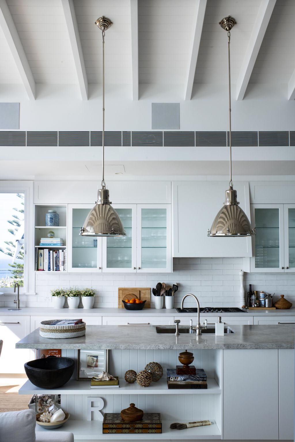 The kitchen, complete with Ralph Lauren pendants. Photo: James Hardie