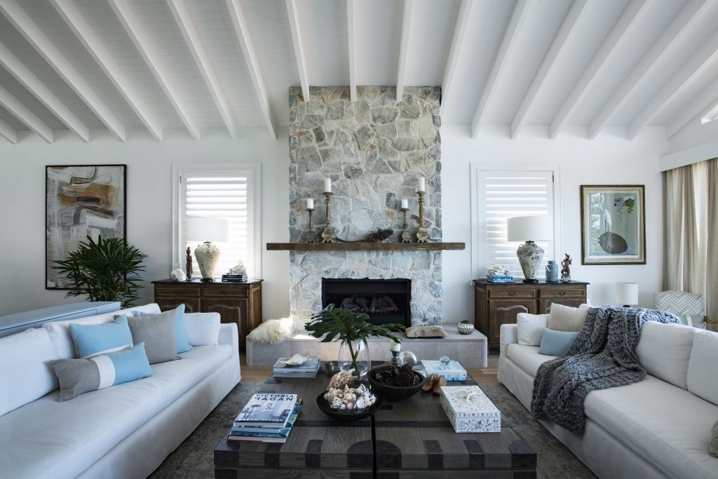 The living space, with Hutton's prized three-seater couches. Photo: James Hardie