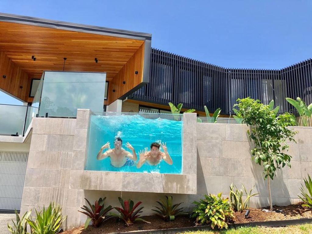 Rob and Andrew Gray, of Graya Constructions, in the pool celebrating the sale of 33 Rockbourne Terrace. Photo: supplied