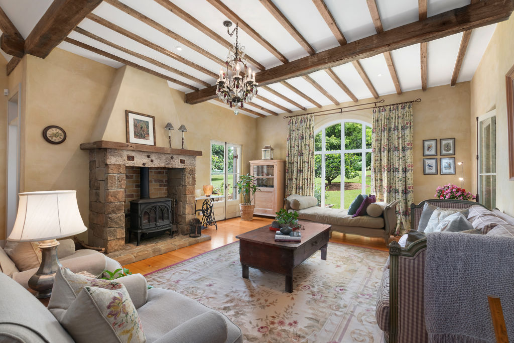 The French-inspired house was rebuilt in 2002 with stone arches and vintage timber doors.