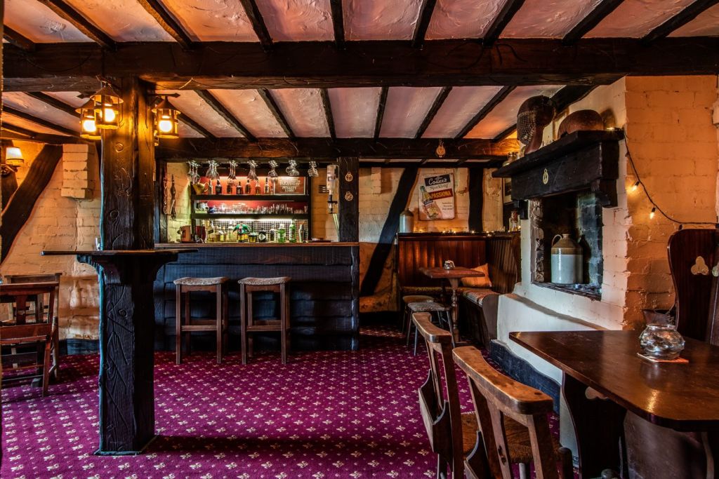 The current owners imported carpet for the downstairs bar in keeping with the English-pub-style atmosphere.