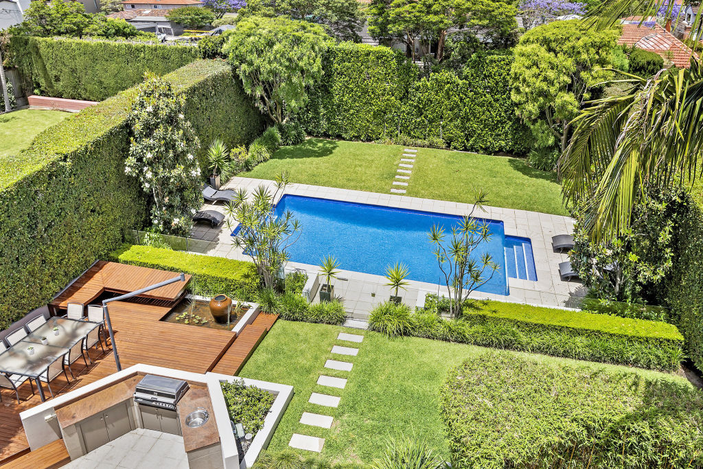 The back garden is a private oasis with a pool, barbecue area and hedging. Photo: Supplied