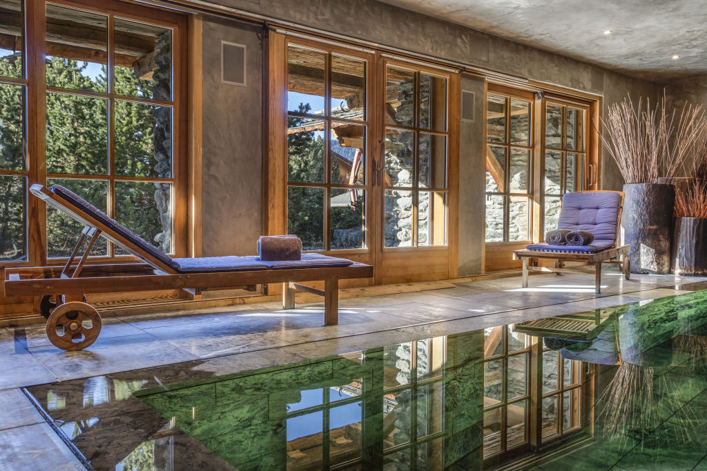 The indoor pool has a sweeping view of the surrounding pines. Photo: Supplied