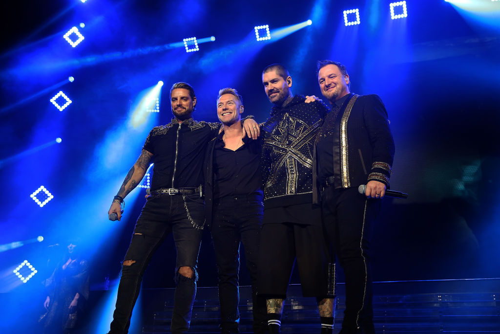 (“I would rather not be on the road, it’s a gruelling life, but it’s what I do,” he says. (L-R) Keith Duffy, Ronan Keating, Shane Lynch and Mikey Graham of Boyzone. Photo: Getty Images