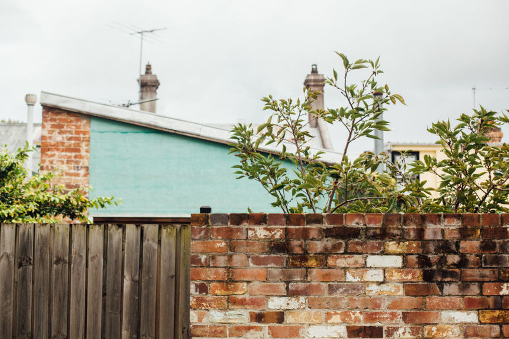 Fences are the number one area of dispute among neighbours. Photo: Stocksy