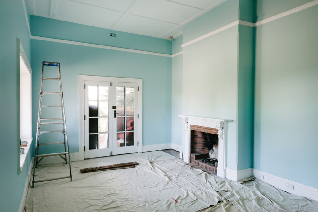 For larger projects, mix paint from multiple tins together to keep the colour consistent. Photo: Stocksy