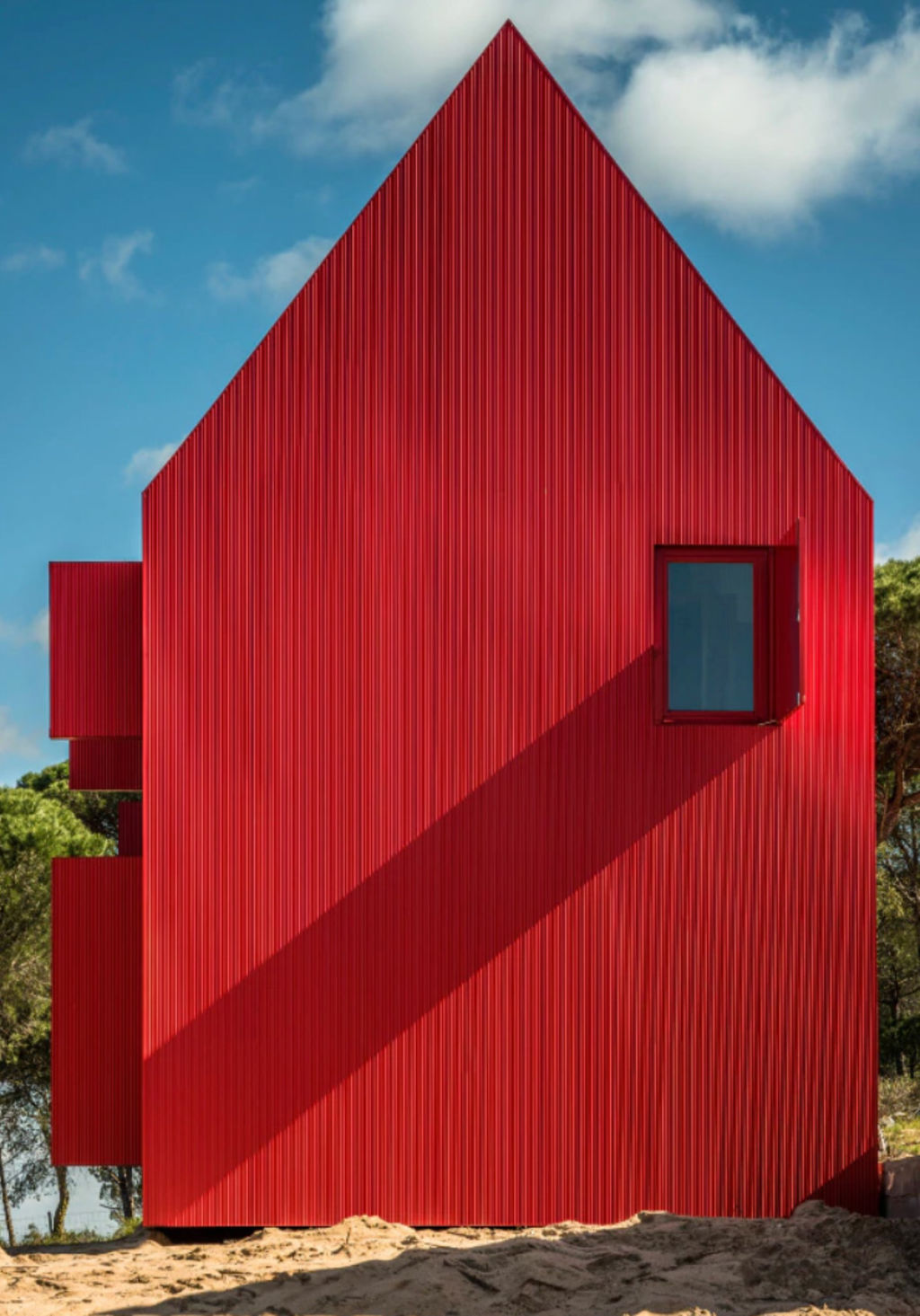 The architect likens the shape of the house to a young child's drawing of a traditional prairie house. Photo: João Guimarães - JG Photography, Carlos Cezanne, Tiago Rebelo de Andrade