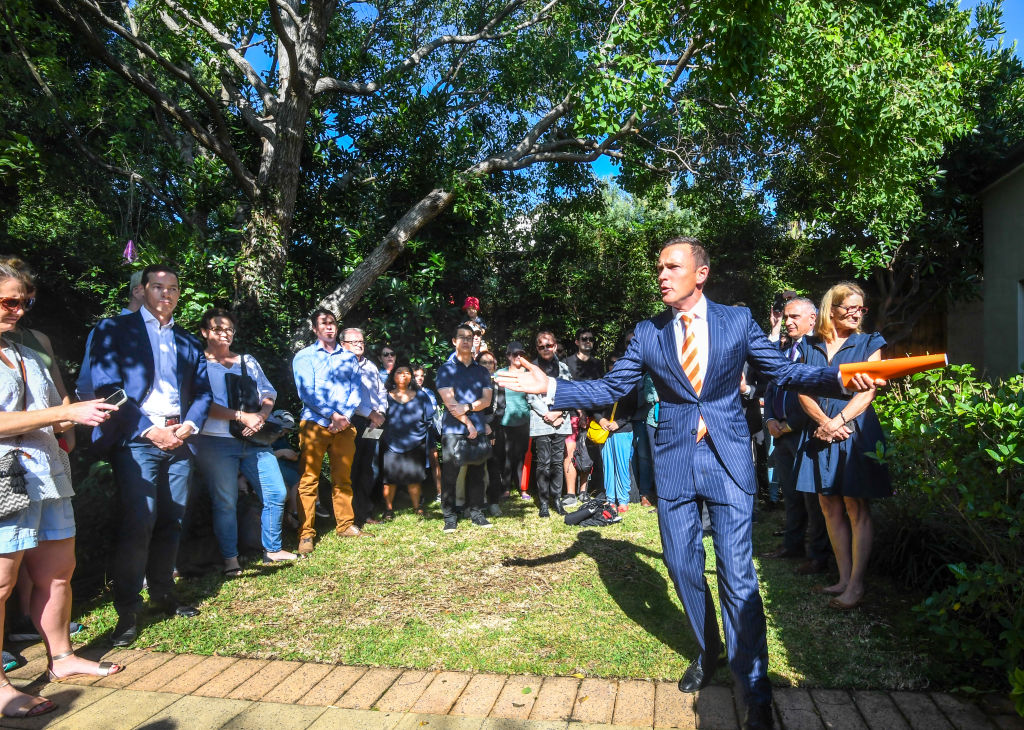 More than 120 people filled up the backyard, the deck and back of the house for the auction. Photo: Peter Rae.