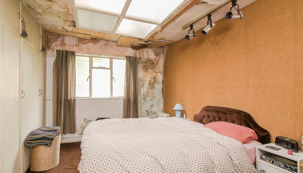 Peeling walls in the property's single bedroom. Photo: lurotbrand.co.uk