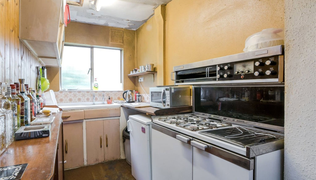 The kitchen is in a similar state of disrepair. Photo: lurotbrand.co.uk
