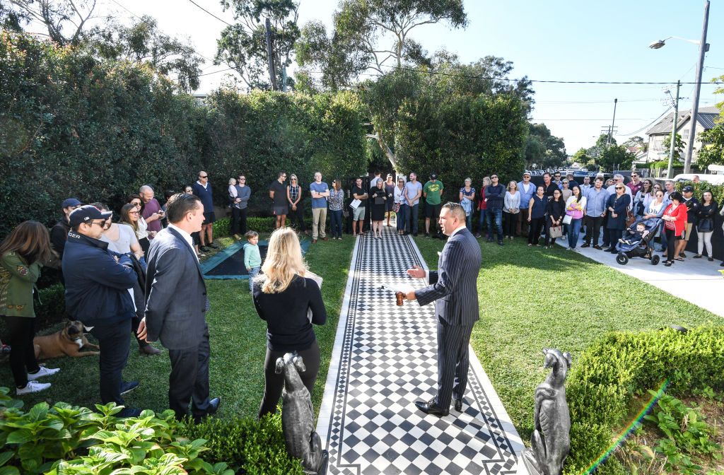 About 80 people turned out for the auction of a Clovelly house which sold for $4.44 million. Photo: Peter Rae
