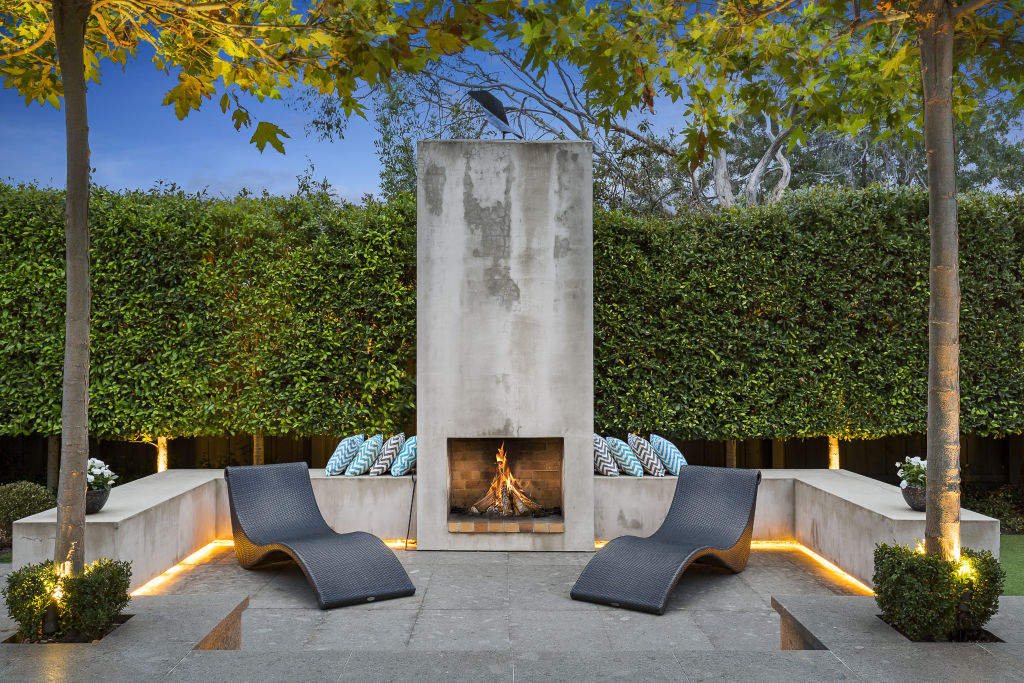 The outdoor lounge and fireplace offer a finishing touch to the garden. Photo: Supplied