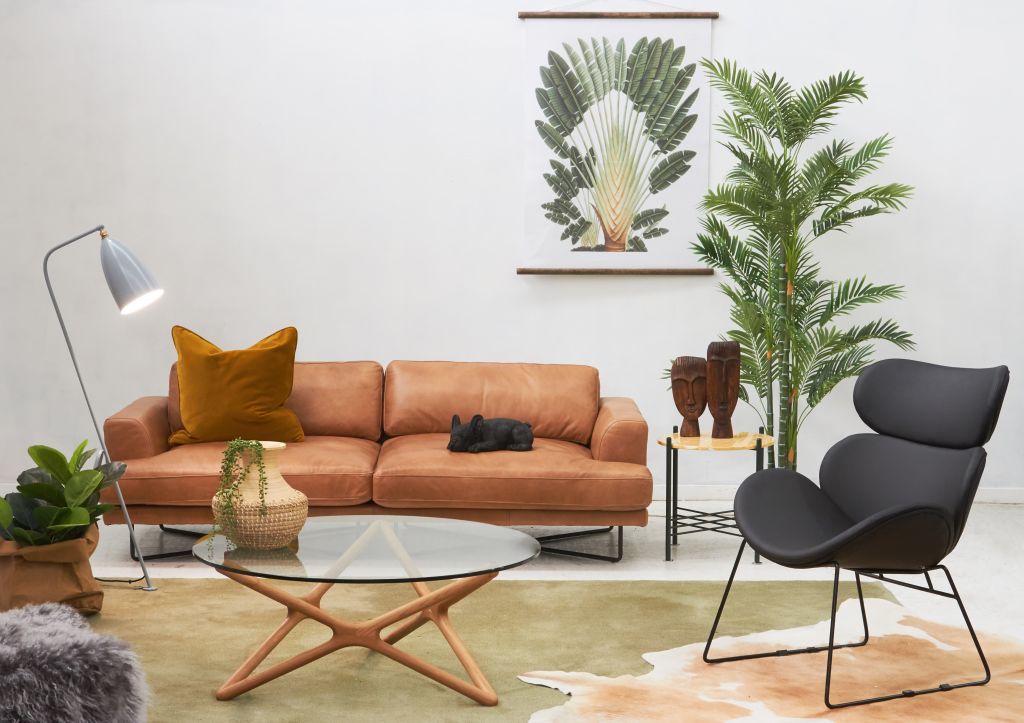 A single, larger sofa combined with an armchair was popular option for smaller spaces. Photo: Matt Blatt