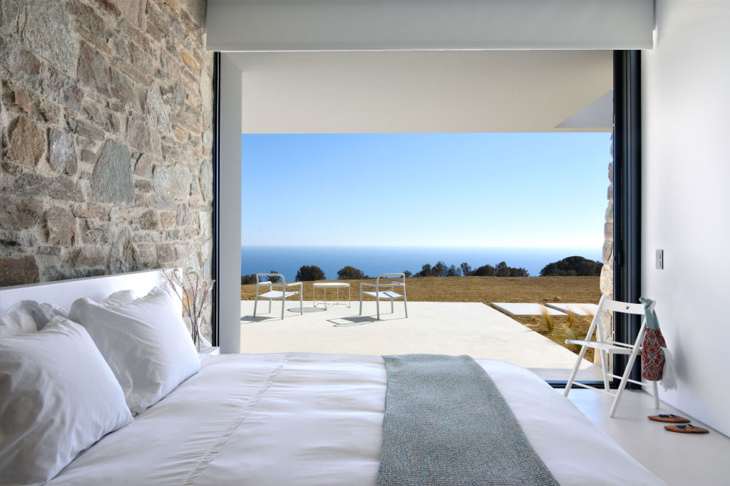 One of the bedrooms in the cliff-side home of Gaia, which is for sale for €5.5 million. Photo: Sotheby's International Realty Greece