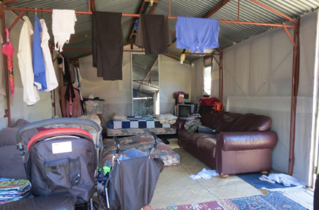 Two children's prams and three mattresses were found in this shed, which was illegally converted into a home for a family. Photo: Supplied by Fairfield City Council/Sydney Policy Lab.