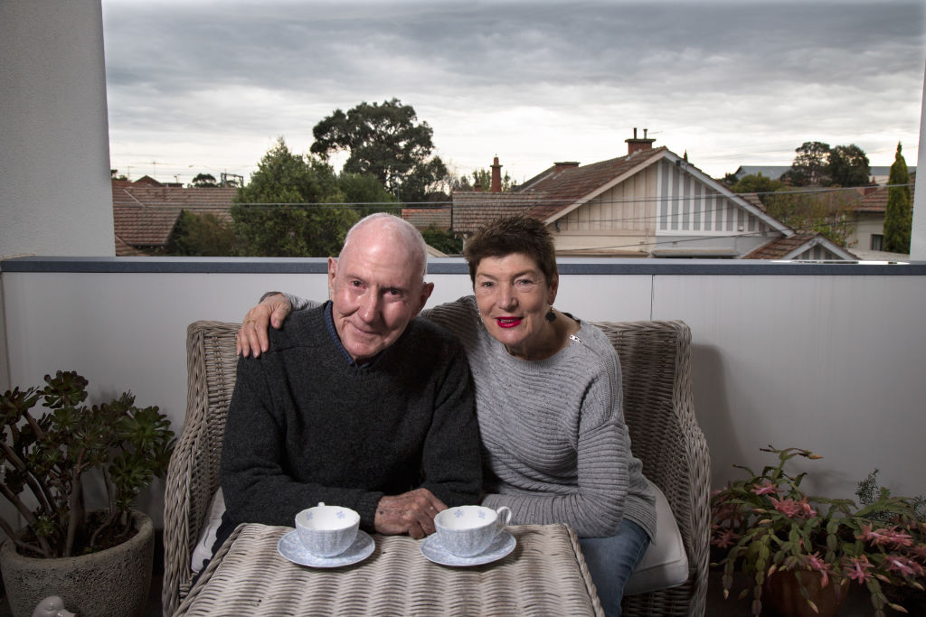 Jack and Carol Hughes on their terrace in their new apartment in Brighton. Photo: Leigh Henningham