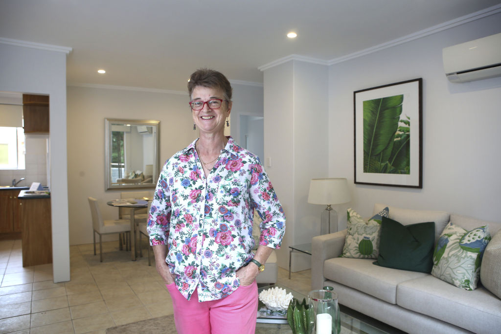 Catherine Boyd at her apartment block in Lane Cove, which is currently on the market. Photo: James Alcock
