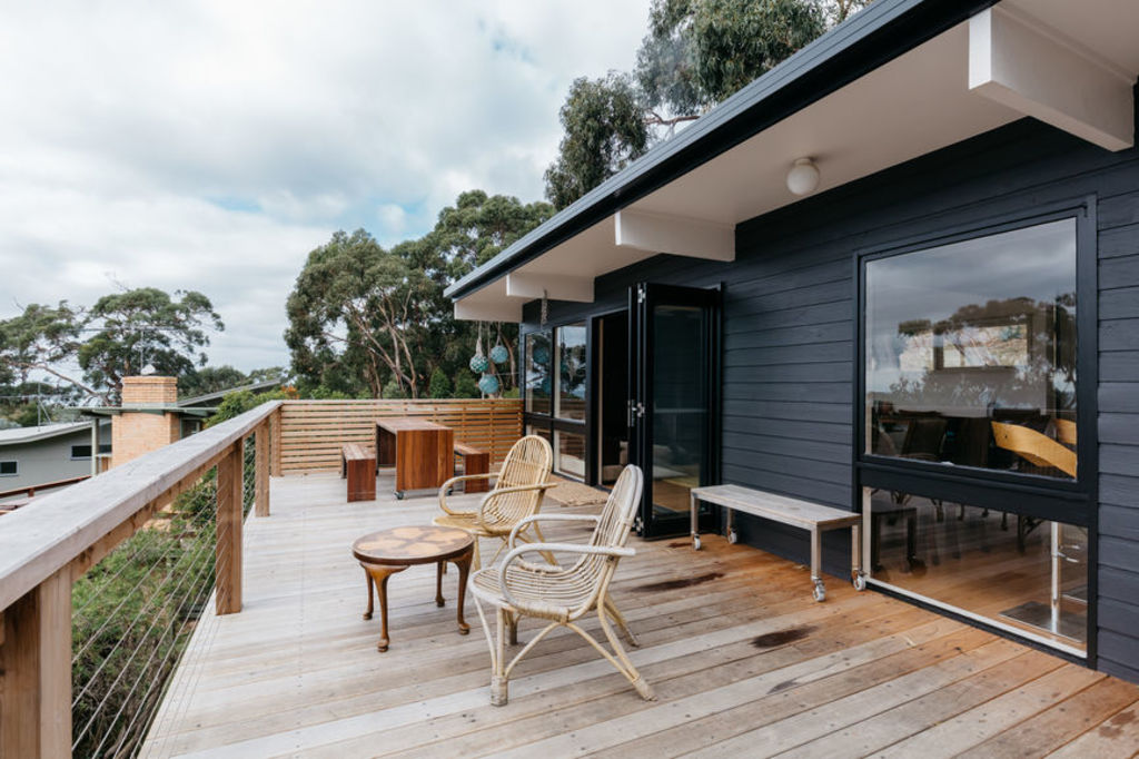 Dark colours can cause real timber to warp in the hot sun. Photo: Stocksy