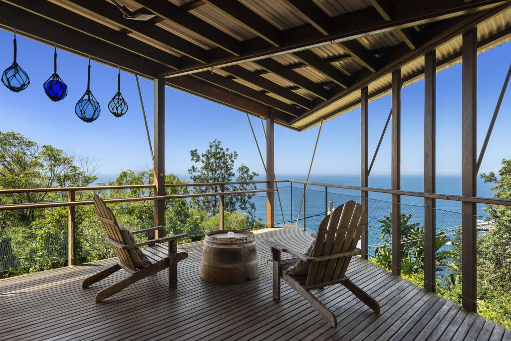 Perched on a sloping block, the home has sweeping views of the ocean. Photo: Supplied