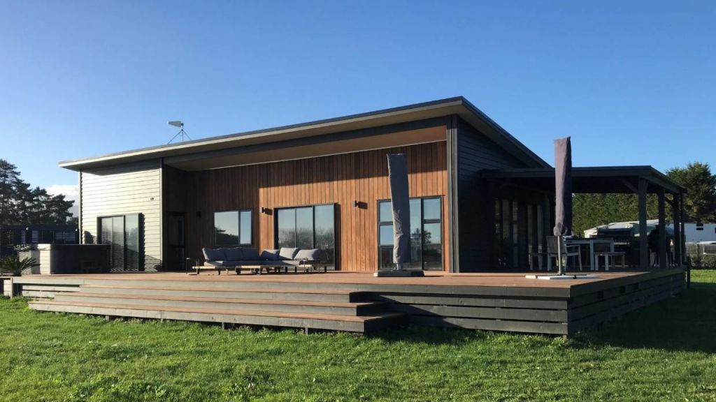 Steve and Sharleen's Bunnings 101 square-metre house at Te Horo, near Otaki, features customised cedar cladding on the front elevation. Photo: Supplied