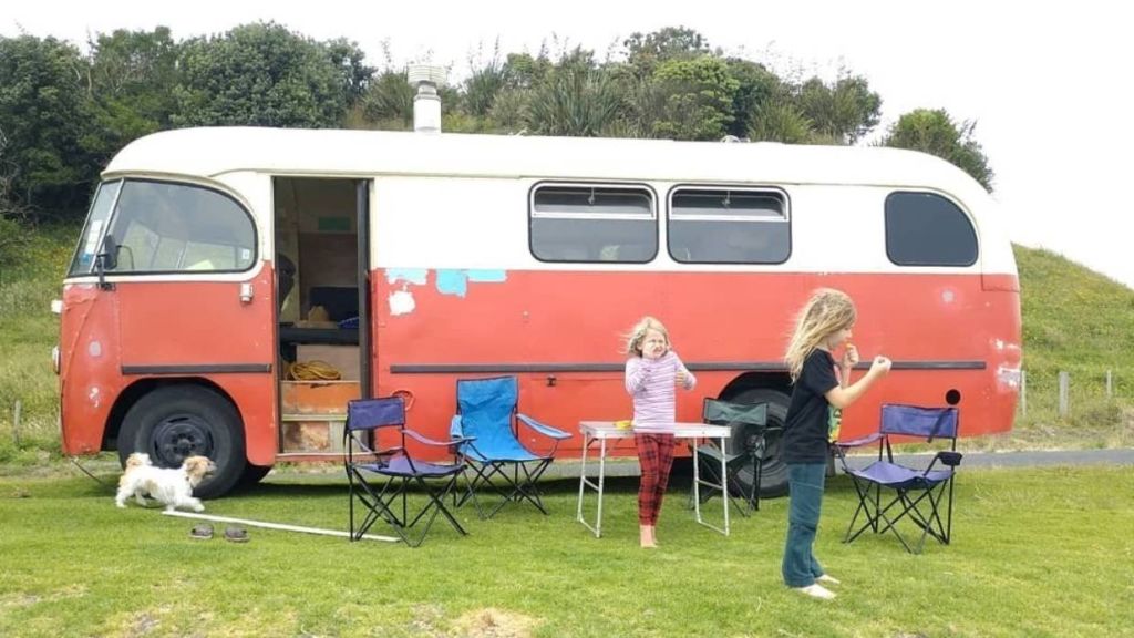 Family trades in six-figure salary for free-spirited life in a house bus