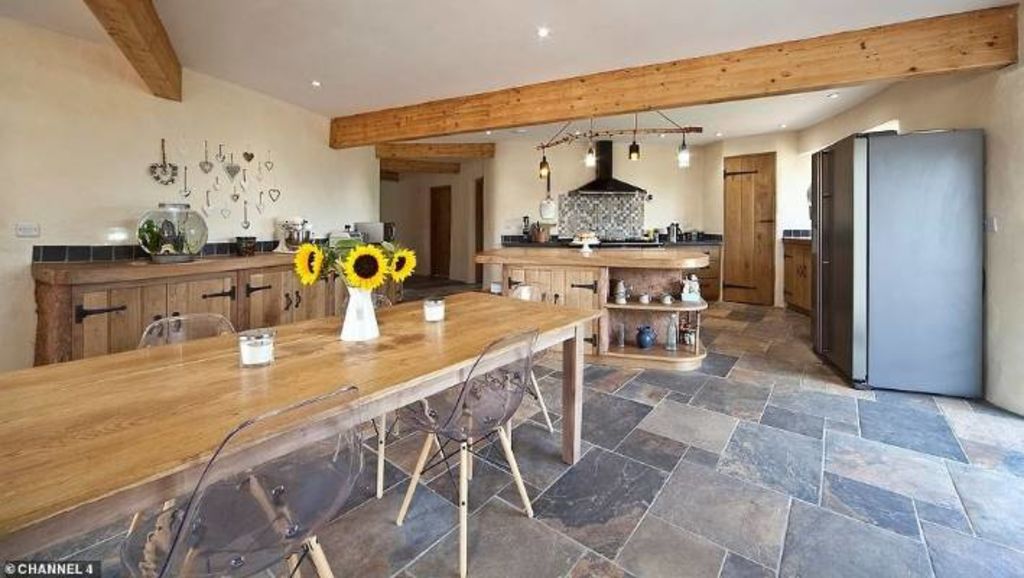 The cob castle kitchen where even the island and cabinets (or cob-inets) are built of cob. Photo: Grand Designs UK