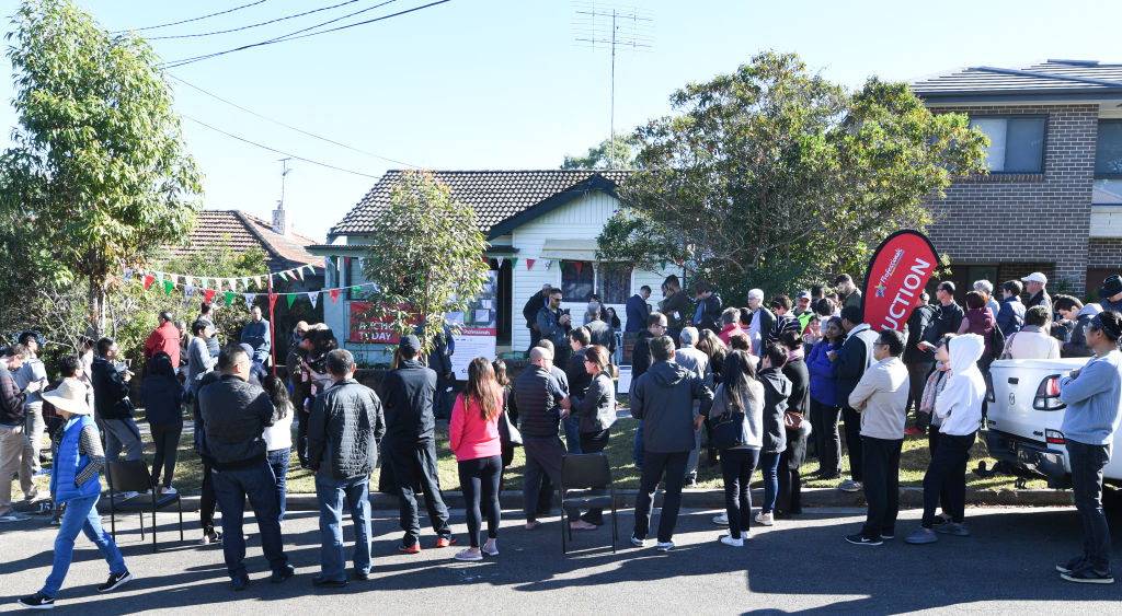 The auction for 15 Linton Avenue, West Ryde drew more than 100 people. Photo: Peter Rae.