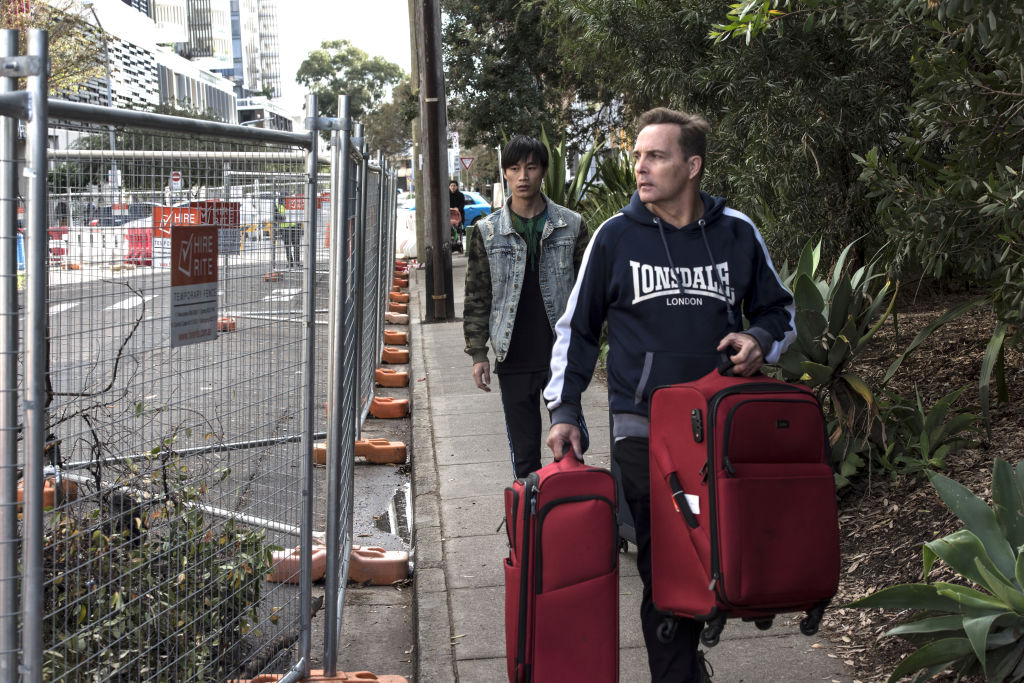 Residents evacuate the Mascot Towers in June, 2019. Photo: Steven Siewert